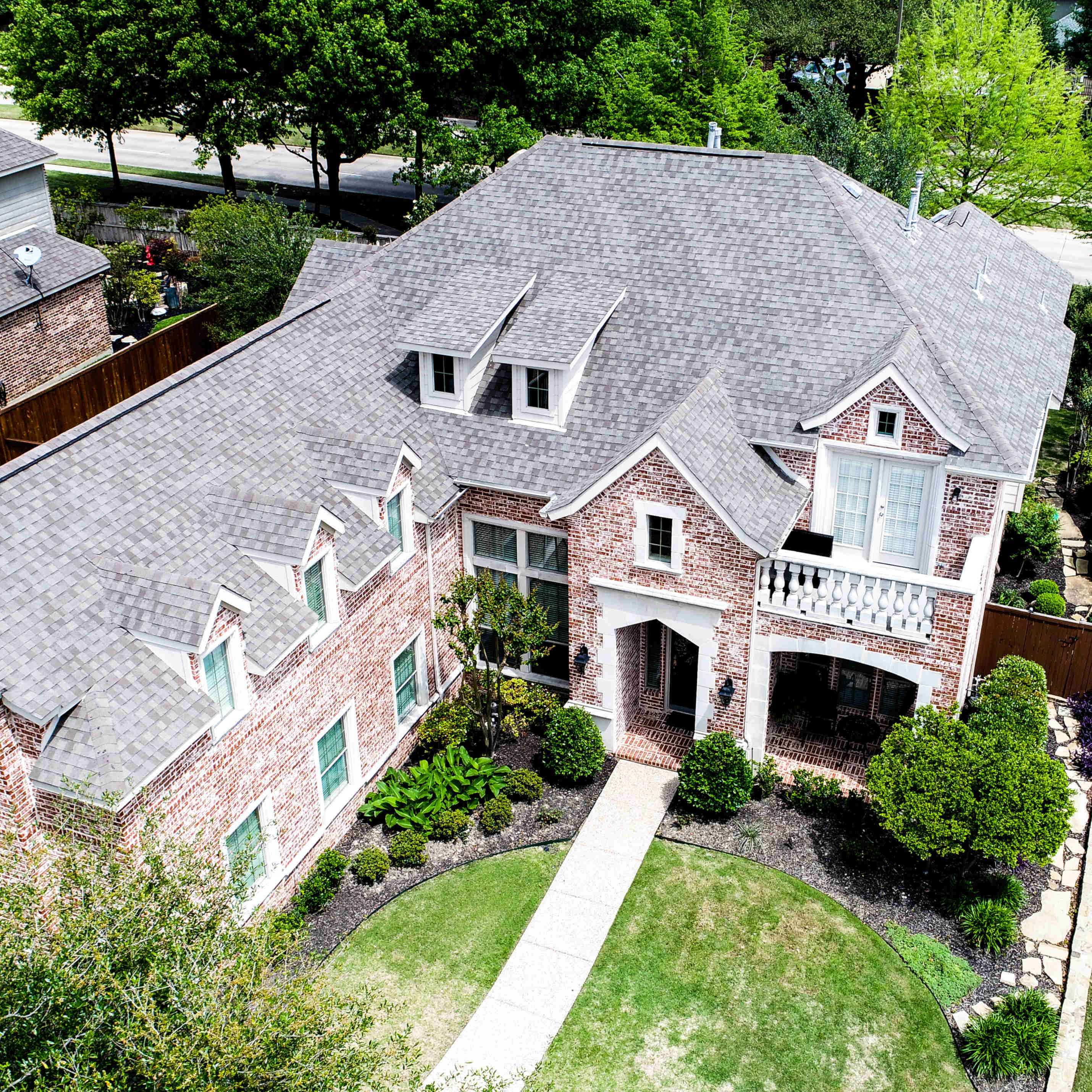 Aerial view of a completed Hickey shingle roof on a Pennsylvania brick home